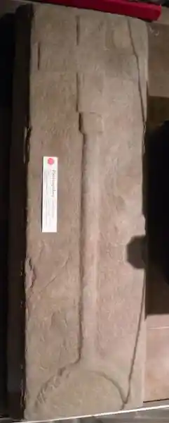 Cross on a pillar on a circle on a tombstone